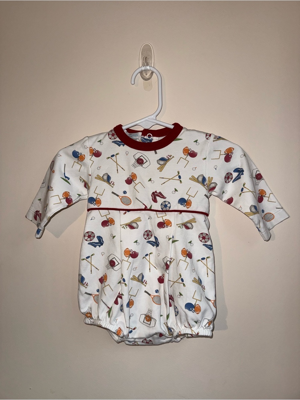 Baby Loren White Baby Romper with Sports Print and Red Trim